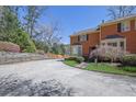 Brick townhome with mature trees and landscaping plus a private drive offers a serene setting at 1363 Sheffield Glen Way, Atlanta, GA 30329
