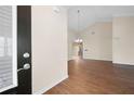 Bright, open-concept living room features hardwood floors, a vaulted ceiling, and neutral paint at 2417 Tree Arbor Way, Marietta, GA 30064