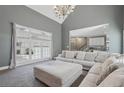 Spacious living room featuring neutral tones, a vaulted ceiling, and plenty of natural light at 4020 Inman Park Lane, Buford, GA 30519