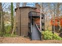Three-story home with multi-level decks and brick chimney at 595 Overbrook Nw Dr, Atlanta, GA 30318