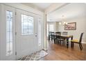 Inviting entryway with decorative glass door, hardwood floors, and dining room view at 331 Greystone Pkwy, Hiram, GA 30141