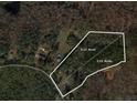 Aerial view of property lines for 5.25 acres of land with mature trees at 1074 Whooping Creek Rd, Carrollton, GA 30116