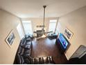 Spacious living room enhanced by high ceilings, a fireplace, and a sectional sofa at 2675 Sardis Chase Ct, Buford, GA 30519