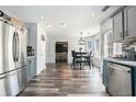 Modern kitchen leads to a charming breakfast nook and features sleek stainless steel appliances at 3287 Shady Valley Ln, Loganville, GA 30052