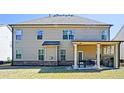 Large back porch with furniture, a BBQ, and outdoor fans at 3489 Central Park Dr, Loganville, GA 30052