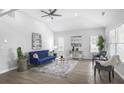 Cozy living room with hardwood floors, a ceiling fan and ample natural light at 652 Hugh Sw St, Atlanta, GA 30310