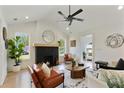 Stylish living room featuring a modern fireplace, high ceilings, and a cozy seating arrangement at 102 Rockyford Ne Rd, Atlanta, GA 30317