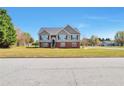 Inviting two-story home with a well-manicured lawn in a suburban setting at 1515 Summer Lake Ter, Loganville, GA 30052