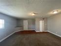 Large living area provides ample space with new carpets and great lighting at 1374 To Lani Farm Rd, Stone Mountain, GA 30083