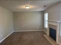 Spacious living room with neutral paint and a fireplace, ready for your personal touch at 1374 To Lani Farm Rd, Stone Mountain, GA 30083