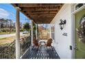 Relaxing front porch with chairs and a porch swing, perfect for enjoying the outdoors at 2531 Paul Nw Ave, Atlanta, GA 30318