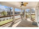 Spacious porch featuring wooden floors, ceiling fan, and a view of the neighborhood street at 3197 Church St, Atlanta, GA 30344