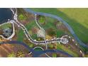 Aerial view of walking paths, water features, and lush landscaping within the community at 235 Rolison Way, Fayetteville, GA 30214