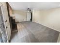Spacious living room with neutral carpet and fireplace, ready for personalization at 724 Dukehart Ct, Stone Mountain, GA 30083