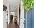 Welcoming foyer features hardwood floors, stairs to the second floor, and views of the living room at 241 Quail Run, Roswell, GA 30076