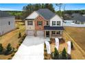 Lovely, modern home shows great curb appeal, an open yard and a two-car garage at 802 Major Oak Ct, Villa Rica, GA 30180
