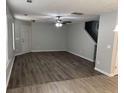 Spacious living room boasts modern flooring, a ceiling fan, and natural light from a large window at 3518 Sable Glen, South Fulton, GA 30349