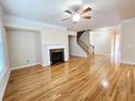 Bright living room showcasing a fireplace, hardwood floors, and open space at 2921 Royston Dr, Duluth, GA 30097