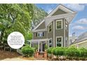 Attractive two-story home with new paint, landscaped front yard, and a welcoming porch at 518 Hill St Se, Atlanta, GA 30312