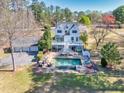 Stunning aerial view of a home featuring a pool and expansive backyard with a detached garage at 1768 Hood Rd, Dacula, GA 30019