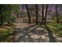 Ranch style home with mature trees, brick accents, and driveway at 1863 Bruce Ne Rd, Atlanta, GA 30329