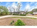 A well-kept front yard and charming exterior create a welcoming curb appeal at 2285 Bascomb Carmel Rd, Woodstock, GA 30189