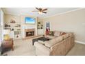 Cozy living room with built-in bookshelves, brick fireplace, and neutral-toned furnishings at 3272 Creek E Trce, Powder Springs, GA 30127