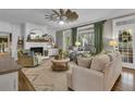 Bright living room featuring stylish furniture, a fireplace, and natural light at 121 Rising Star Rd, Fayetteville, GA 30215