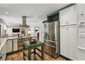 Spacious kitchen with granite countertops, stainless steel appliances, and custom cabinetry at 205 Glencourtney Dr, Sandy Springs, GA 30328