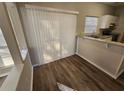 Charming dining area with hardwood floors, a breakfast bar, and sliding glass doors for easy outdoor access at 6406 Laurel Post Dr, Lithonia, GA 30058