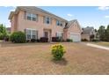 Traditional two-story home showcasing a lush front yard and inviting curb appeal at 765 Rock Ln, Mcdonough, GA 30253