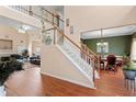 Spacious foyer showcasing hardwood floors and a graceful staircase at 765 Rock Ln, Mcdonough, GA 30253