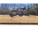 Stunning two-story brick home with beautiful architectural details and landscaping at 25 Mountain Crest Dr, Oxford, GA 30054