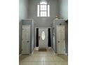 Bright foyer features a large window above the front door and tiled flooring at 2469 Briar Knoll Rd, Lithonia, GA 30058