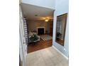 Inviting living room with tile flooring, a fireplace, and black and white accents at 2469 Briar Knoll Rd, Lithonia, GA 30058