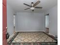 Inviting living room featuring a ceiling fan and neutral paint at 3844 Oglesby Rd, Powder Springs, GA 30127