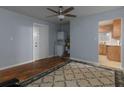 Spacious living area with hardwood floors, laundry hookups and connections to the kitchen at 3844 Oglesby Rd, Powder Springs, GA 30127