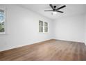 Bright, freshly painted bedroom featuring modern ceiling fan and wood-look laminate flooring at 3569 Vinyard Way, Lawrenceville, GA 30044