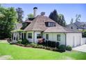 Beautiful home featuring a well-maintained lawn and an attached two-car garage at 406 Whitmore Nw Dr, Atlanta, GA 30305