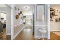 Inviting foyer with decorative wall accents, chandelier lighting, and hardwood flooring throughout at 4630 Smokestone Dr, Douglasville, GA 30135
