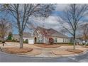 Beautiful corner lot home featuring neutral siding, dark shutters, and a well maintained lawn at 6245 Milton Dr, Cumming, GA 30041