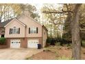 Two-story home featuring a two-car garage and a traditional facade at 2425 River Place Xing, Douglasville, GA 30135