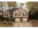 Two-story home featuring a two-car garage and a traditional facade at 2425 River Place Xing, Douglasville, GA 30135