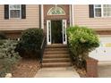 A brick stairway leading to the front door with manicured landscaping at 2425 River Place Xing, Douglasville, GA 30135