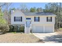 Attractive home with a two-car garage, symmetrical windows, and a well-maintained lawn at 114 Connie Dr, Dallas, GA 30157