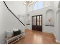 Bright foyer with hardwood floors, high ceilings, arched doorways and staircase at 303 Rolling Rock Se Rd, Marietta, GA 30067