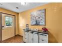Inviting entryway with decorative glass door and stylish cabinet decor at 8698 Twin Oaks Dr, Jonesboro, GA 30236