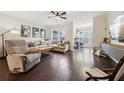 Spacious living room with hardwood floors, large windows, and comfortable seating at 1198 Olmsted Park Rd, Decatur, GA 30033