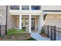Inviting front porch with fire pit and seating area perfect for relaxing outdoors at 227 Atley Pl, Alpharetta, GA 30009