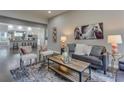 Inviting living room with hardwood floors, stylish decor, and an open layout flowing into a bright kitchen at 576 Quillian Ave, Decatur, GA 30032